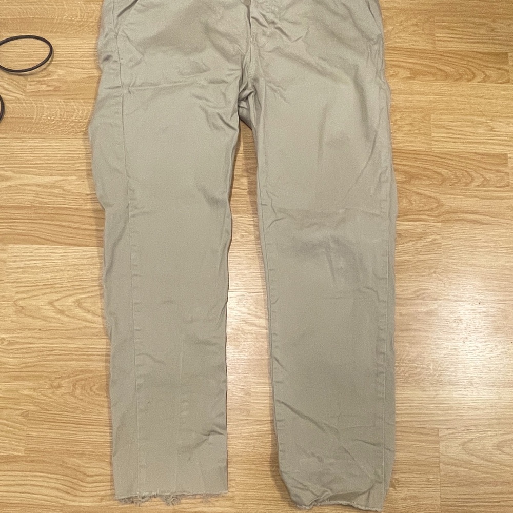 Top man stretch skinny. Torn cuff from manufacturer. 36 w 34 L